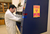 CBP Laboratory personnel remove items from x-ray testing equipment.