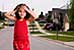 Welcome: Portraits of America, young girl standing in the street of a neighborhood