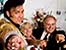 Welcome: Portraits of America, man dressed as Elvis Pressley with a bride and groom