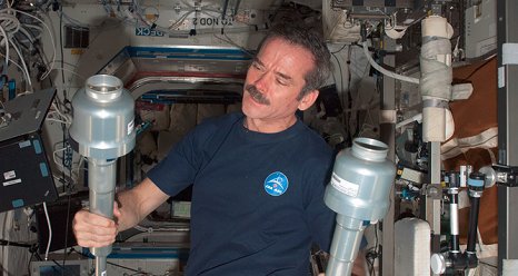 Canadian Space Agency astronaut Chris Hadfield holds two Material Science Laboratory Solidification and Quench Furnace (MSL SQF) Sample Cartridge Mechanical Protection Containers (MPCs) during the cartridge exchange in the Destiny laboratory of the International Space Station. (NASA)