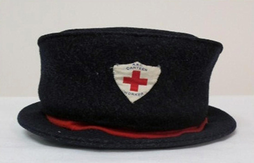 preservearchives:

When the Red Cross artifacts first come into the lab, they are carefully removed from their archival boxes.  This WWI Canteen Worker hat, 1914-1918, is made of blue wool with red hand sewn trim. The hat is shown before Pat pads the inside with cotton stuffers and non-buffered abaca fiber tissue.

