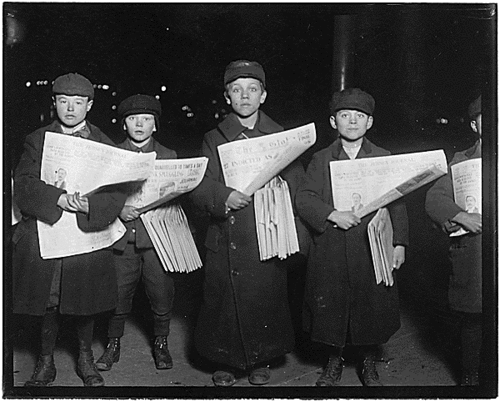
Newsies selling at the Hudson Tunnel Station, Jersey City. Boy on left is Patrick Drohan, 12 years old. Next to him is Stanley Fazurowski, 9 years old. Largest boy is 13 years old. Jersey City, N.J., 12/21/1909
From the series National Child Labor Committee Photographs taken by Lewis Hine
