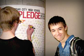 Two teen boys register for a pledge
