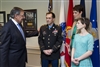 Secretary Panetta talks with former Army Staff Sgt. Clinton Romesha, his wife Tammy and daughter Dessi in his Pentagon 