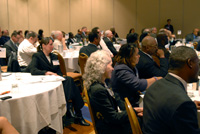 Foreground: Members of the Boston delegation listen as Sec. Duncan delivers his remarks