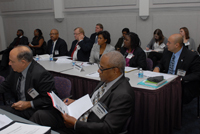 Foreground: Guillermo Cespedes, Deputy Mayor, Gang Reduction and Youth Development, Los Angeles, CA and Gary Slutkin, Executive Director, CeaseFire, Chicago, IL. Background: Members of the Chicago team