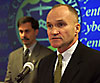 U.S. Customs Commissioner Raymond W. Kelly (right) joins with the director of the Customs Cyber Smuggling Center Kevin Delli-Colli in answering questions from the press during the dedication of the new facility.
