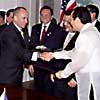 After signing the Mutual Customs Assistance Agreement, US Customs Commissioner Raymond W. Kelly handing over the Mutual customs assistance Agreement to Ernesto M. Maceda the Philippine Ambassador to the United States, as President Estrada of the Philippines looks on.