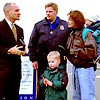 U.S. Customs Commissioner Raymond Kelly speaks with Inspector Mike Chapman and his family following a ceremony at Port Angeles, Washington.
