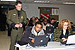 A Border Patrol agents assists Career Day participants in a computer lab set up for the “New Year, New Career” job fair in Detroit.