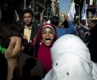 A demonstrator makes here position on the constitution known in Cairo. (AP Images)