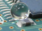 A water droplet on a waterproofed circuit board.