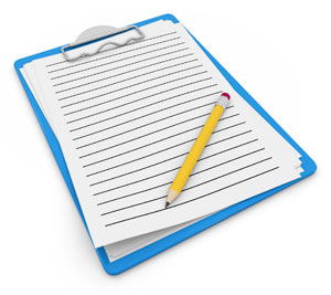 Photograph of a clipboard with paper and a pencil.