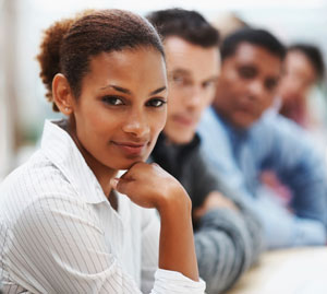 Photograph of a diverse group of young men and women looking at the camera.