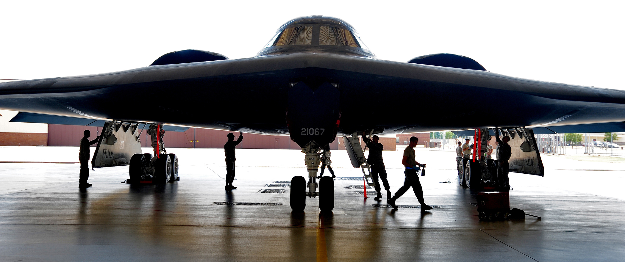 U. S. Air Force Airman are conducting maintenance on a Stealth Bomber.
