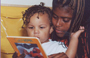 Woman reads to a young child