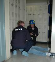 Two NCIS agents with body on floor