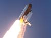 Space shuttle Discovery lifts off.