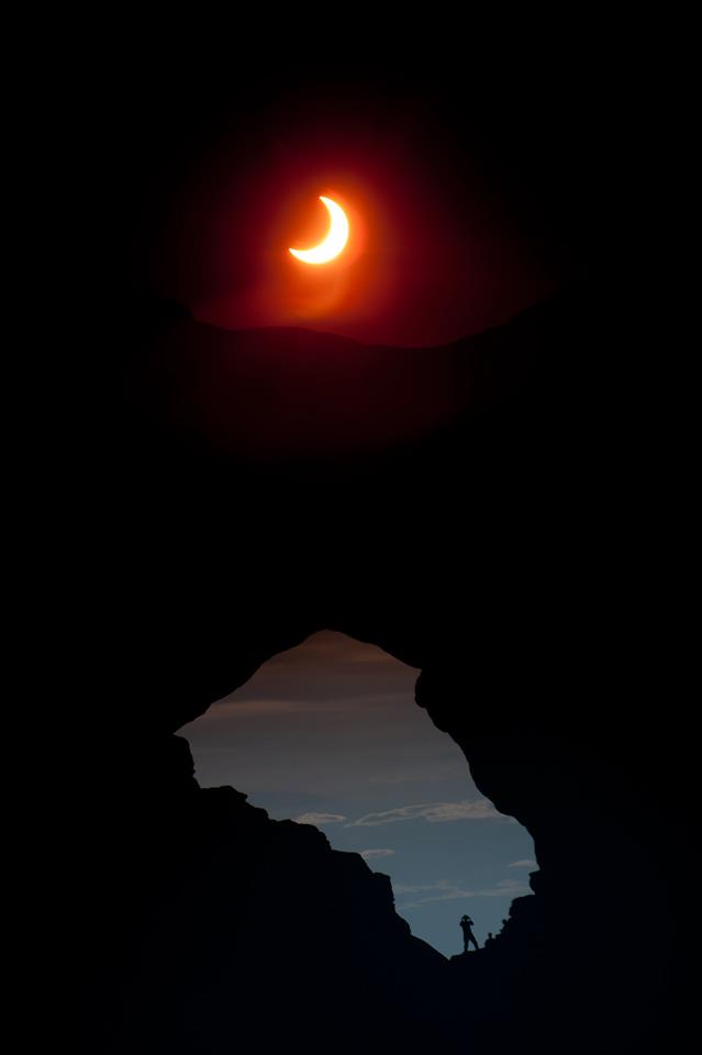 Image description: A picture of the solar eclipse that happened over the weekend taken at Arches National Park in Utah.
Photo from the National Park Service.