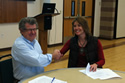 Herb Gibson, OSHA Denver Area Office director and Tara Steinke, president, DJ Basin Safety Council sign an alliance to improve worker safety and health in the oil and gas industry in northern Colorado. Click to view larger image.