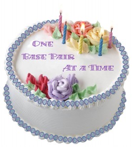 cake with double helix decoration - text: One base pair at a time