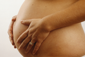 bare pregnant woman's stomach