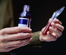 A photograph of liquid medicine and measuring spoon