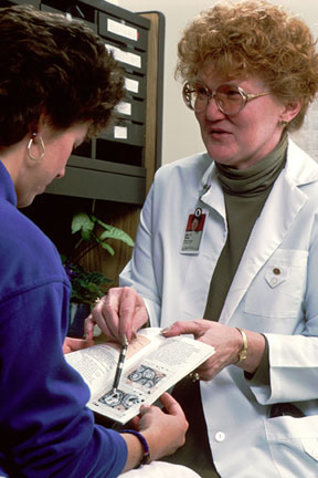 Nurse discussing palliative care choices with a patient