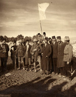 A group of men with a flag