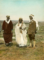 Three men in an open landscape