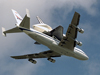 The Space Shuttle orbiter Endeavour passes over KSC's Shuttle Landing Facility atop NASA's Boeing 747 Shuttle carrier Aircraft (SCA) as it returns March 27, 1997 from Palmdale, Calif.