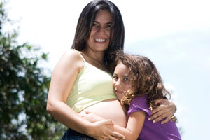 pregnant woman and her daughter
