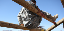 Soldier negotiating obstacle