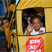 Young children playing in a miniture school bus