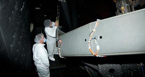 John Grunsfeld (left) and a DSI telescope technician examine the framework supporting the 100-inch primary mirror in the telescope cavity of NASA's SOFIA flying observatory