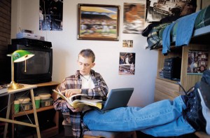 Boy studying in dorm room