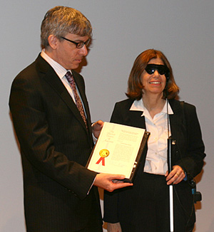 Robert J. Greenberg, M.D., Ph.D., Second Sight’s president/CEO and Barbara Campbell, Argus II user.