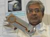 Scientist Shri Kanekal holds one of the solid-state detectors that will be used in the CREPT.