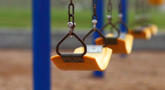 Empty swings on a playground