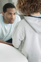 Father having a serious conversation with young son