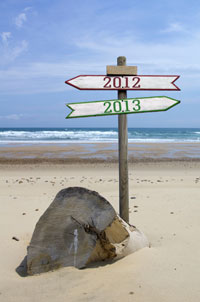 Road sign showing 2012 in one direction and 2013 in the other.