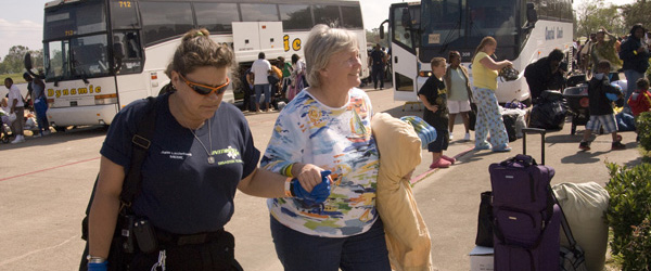 FEMA volunteer helps woman returning home