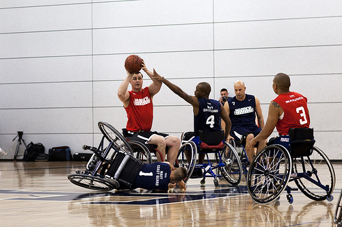 Image description: Sgt. Stephen K. Lunt, left, from Moncks Corner, S.C., prepares to pass the ball to Cpl. Josue Barron, from Los Angeles, during a wheelchair basketball game between the Marine Corps and the Navy/Coast Guard at the 2012 Warrior Games.
Photo by Lance Cpl. Chelsea Flowers, U.S. Marine Corps