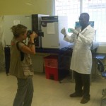 USAID photographer Kendra Helmer taking pictures in the lab.