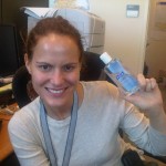 Emily McCormick holding bottle of hand sanitizer.