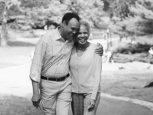 black and white photo of couple walking outside