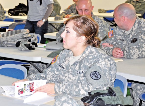 Spc. Ezonica Castellano, who arrived in Wiesbaden, Germany, Jan. 11, 2013, said her sponsor was exceptional. Here, she attends a Red Cross briefing during inprocessing.