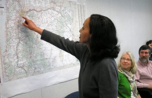 Woman pointing to a map