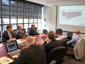 Erskine (left) at presentation showing time-lapse sequence of the building of the Ohio Supercomputer Center. (Photo: the Ohio Supercomputer Center)  