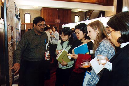 Dr. Rajeev Agarwal talks with several visitors.